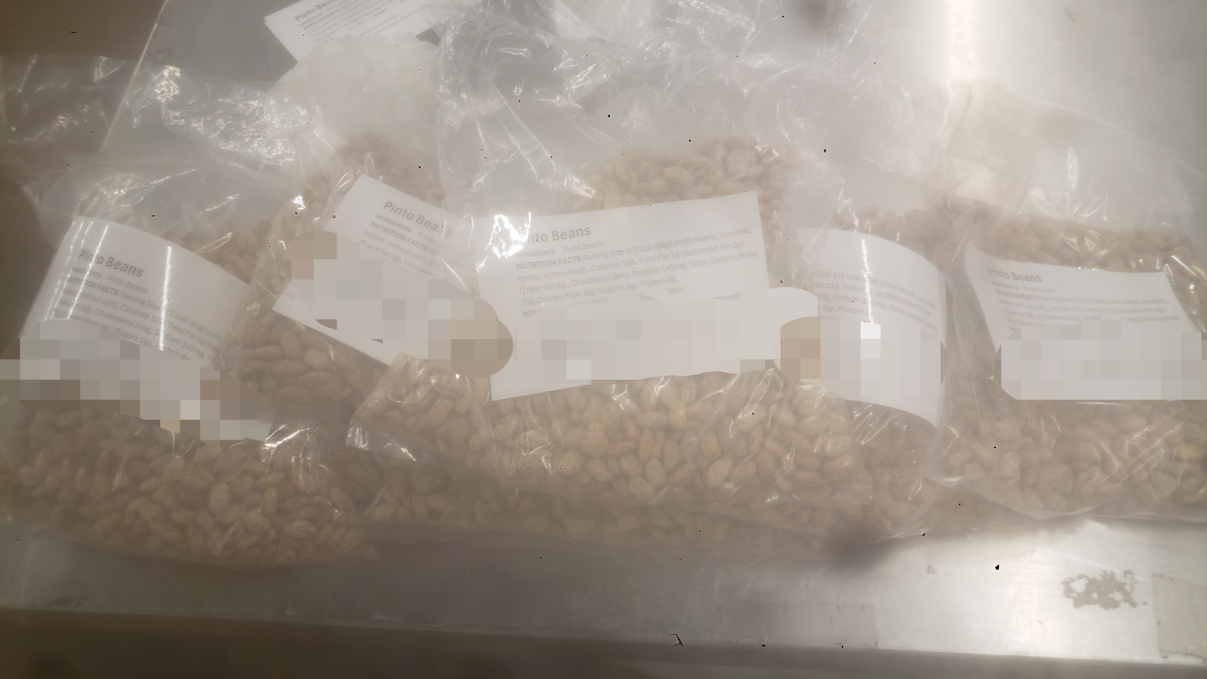 Labeled bags of pinto beans.